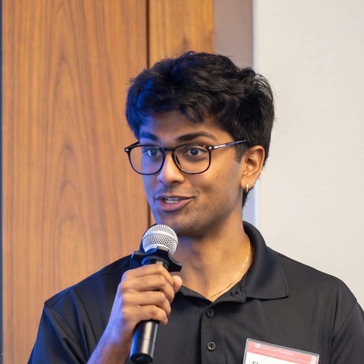 Shreshth Saride speaking into a microphone